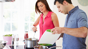 cooktops couple cooking dinner