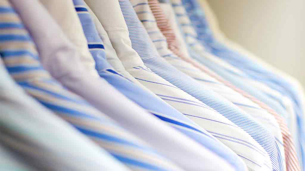 shirts hanging on clothes rack