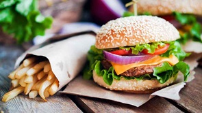 burger and fries on outdoor table