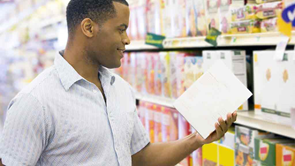 shopper looking at a product label