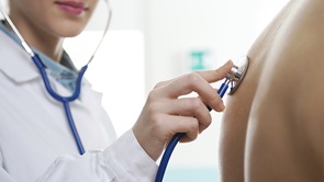 doctor using stethoscope on back