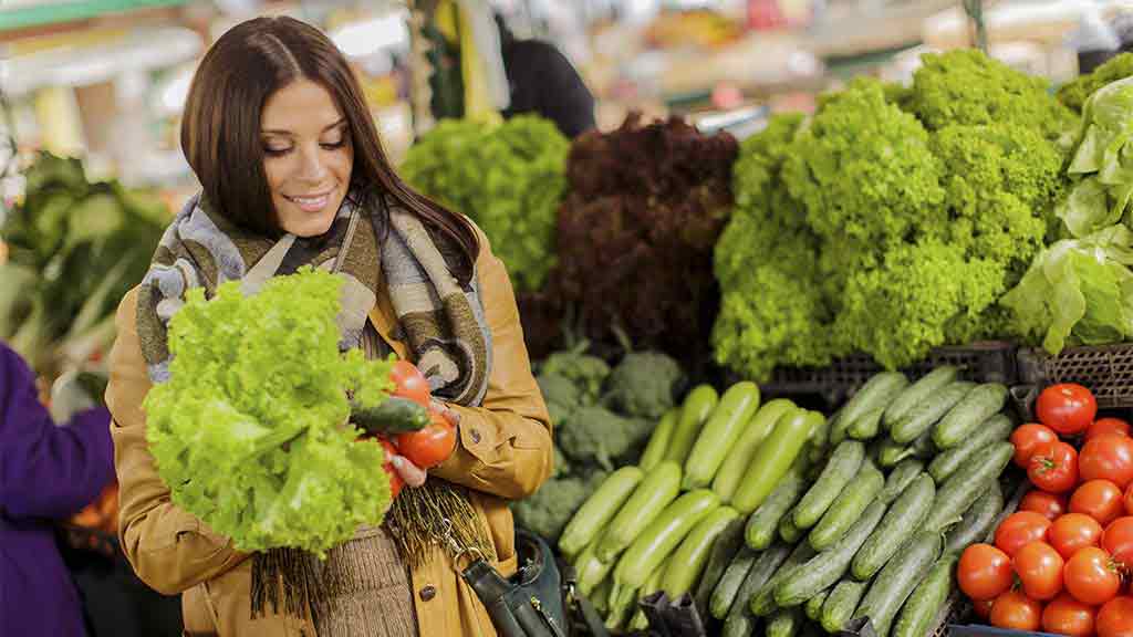 woman buying fruit and vegetables