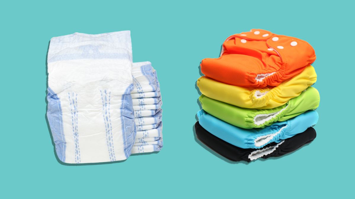 reusable and disposable nappies on teal