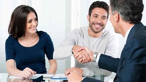 couple shake hands with man